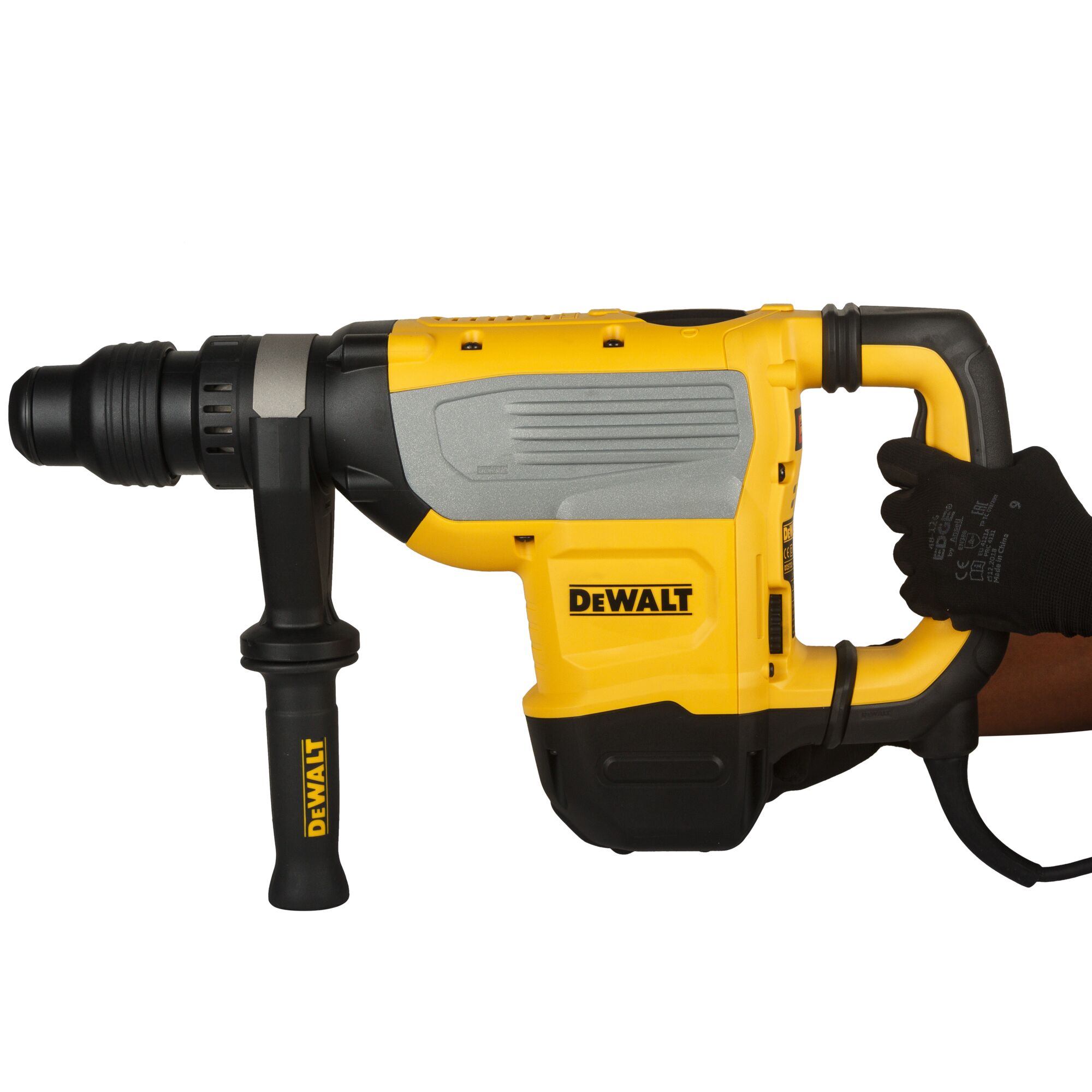 A close-up image of a DEWALT-branded yellow and black rotary hammer drill, held by a gloved hand. The tool has a side handle for stability and is designed for heavy-duty construction tasks.