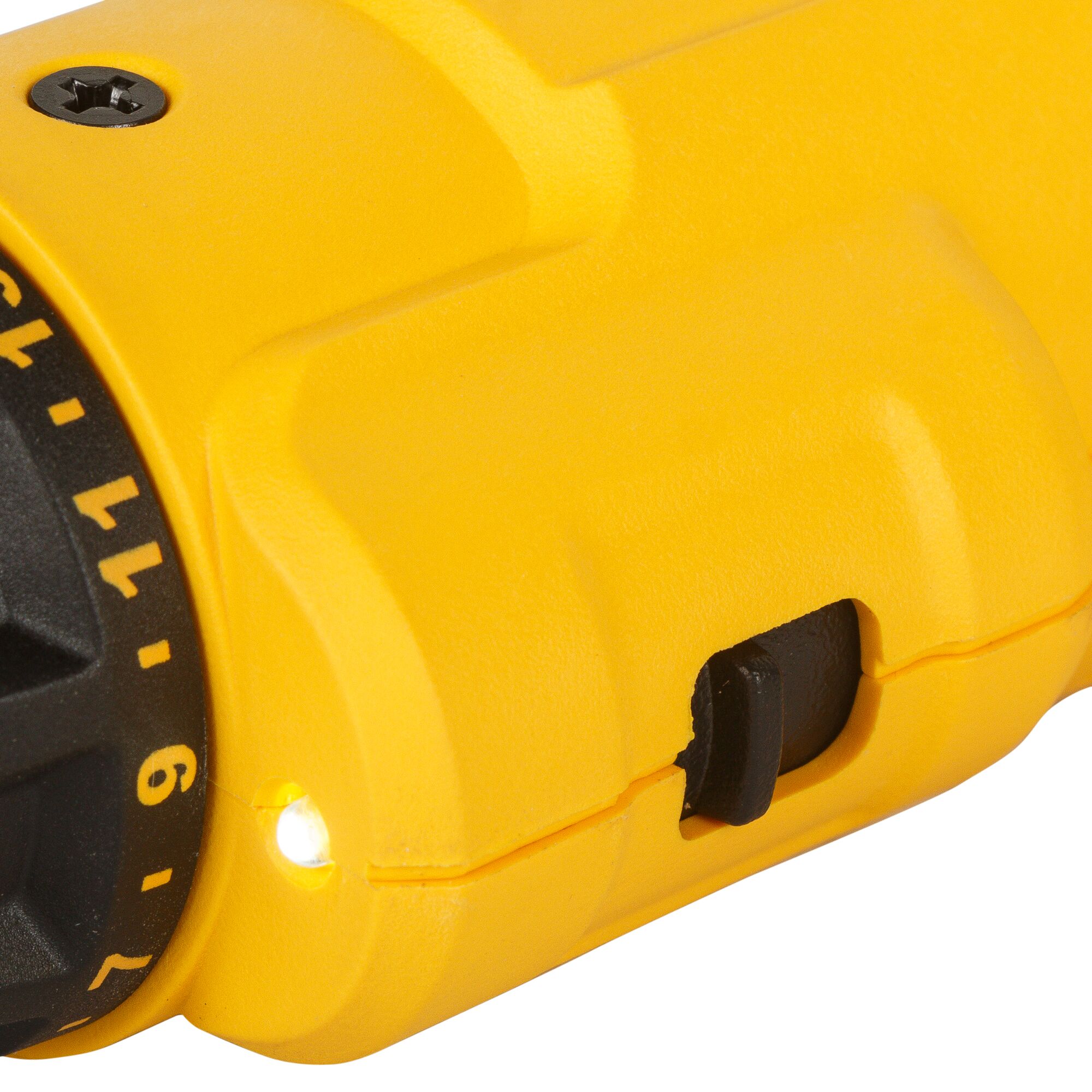 Close-up of a yellow DEWALT power tool, showing its numeric dial, LED light, and a black switch.