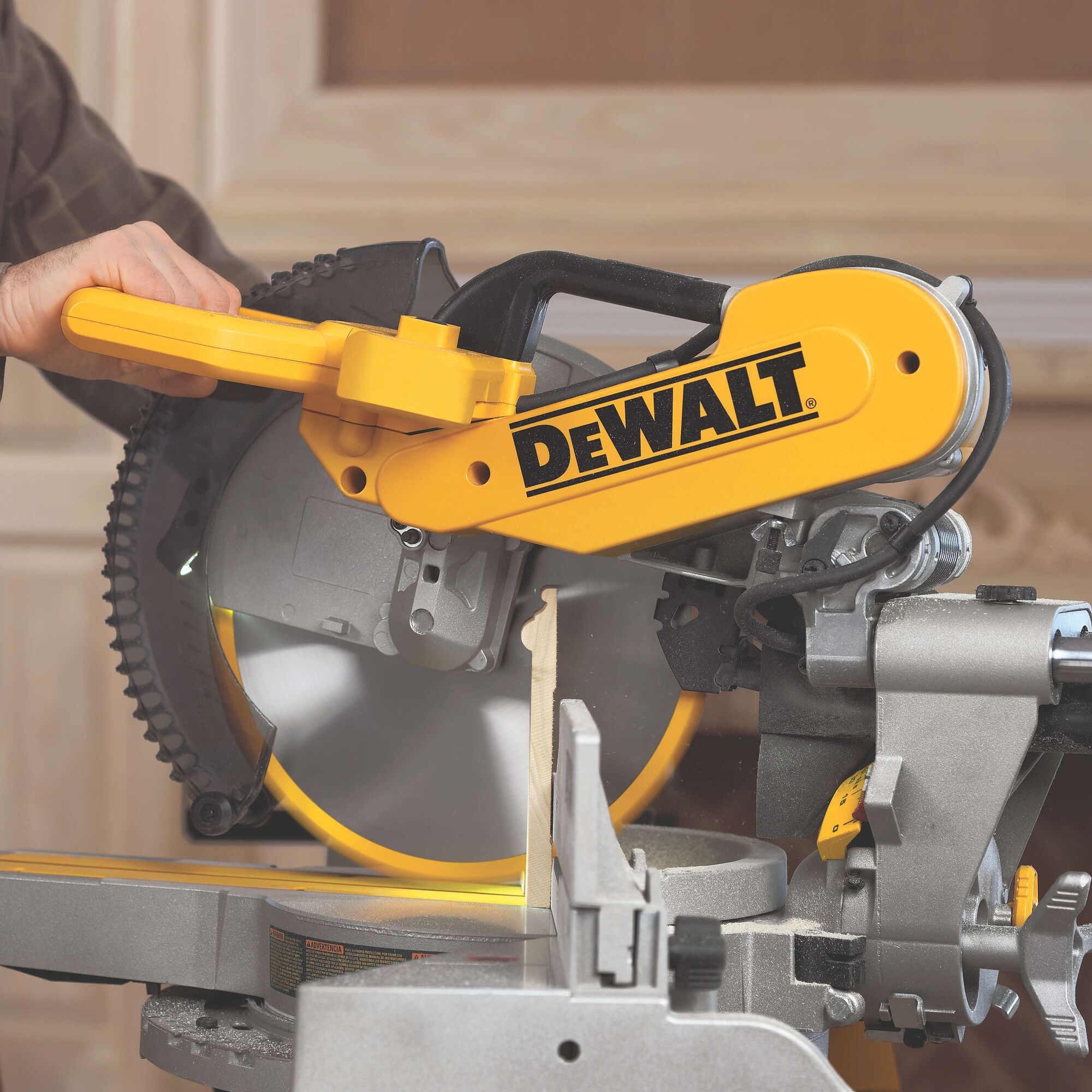 DEWALT DWS780, DWS780KIT miter saw in use, cutting wood. Photography category.